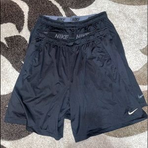 TWO PAIRS OF NIKE DRI FIT